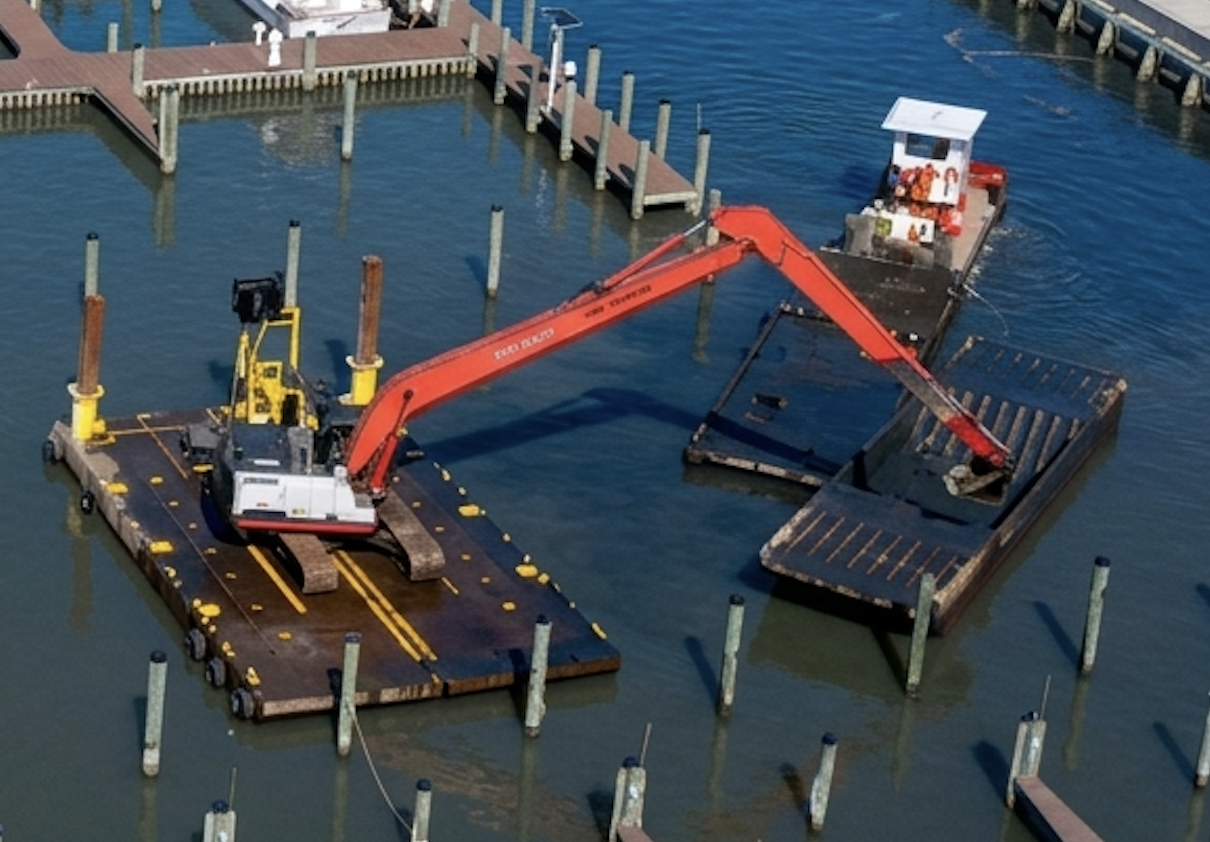 Amphibious long-reach excavator dredging